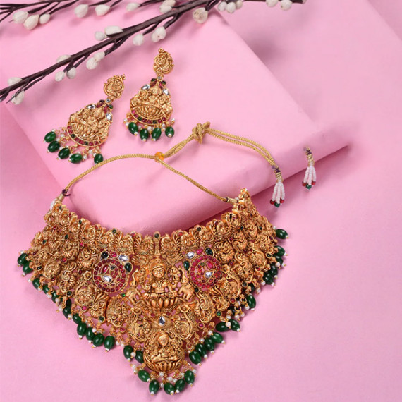 https://fineclothes.in/products/gold-plated-kemp-stone-studded-lakshmi-design-with-dangling-green-beads-choker-set